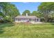 Expansive backyard featuring lush green lawn and a patio, perfect for outdoor entertaining and relaxation at 3619 Chilham Pl, Charlotte, NC 28226