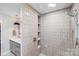 The bathroom features a stylish vanity, modern fixtures, and decorative tiling in the shower at 3619 Chilham Pl, Charlotte, NC 28226