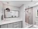 This bathroom includes a stylish vanity, modern fixtures, and decorative tiling in the shower at 3619 Chilham Pl, Charlotte, NC 28226