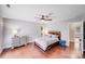 Large main bedroom with hardwood floors, ceiling fan, and natural light at 3619 Chilham Pl, Charlotte, NC 28226