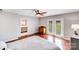 This room features hard wood floors, a ceiling fan, an ensuite and French doors to the patio at 3619 Chilham Pl, Charlotte, NC 28226