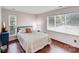 Light-filled bedroom with hardwood floors, minimalist design, and ample sunlight at 3619 Chilham Pl, Charlotte, NC 28226