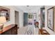 Foyer with tile flooring, area rug, and entry to porch, seamlessly connecting indoor and outdoor spaces at 3619 Chilham Pl, Charlotte, NC 28226