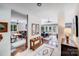 Hallway leads to dining area and living room, showcasing open floor plan and wood-look flooring at 3619 Chilham Pl, Charlotte, NC 28226