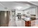 Bright kitchen featuring granite countertops, white cabinets, and stainless steel appliances at 3619 Chilham Pl, Charlotte, NC 28226