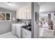 The laundry room boasts new washer and dryer units, granite counter tops, and cabinet space at 3619 Chilham Pl, Charlotte, NC 28226