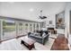 Spacious living room featuring a fireplace, built-in shelving, and large windows at 3619 Chilham Pl, Charlotte, NC 28226