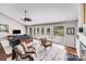 Open living space with hardwood floors, fireplace, and seamless transition to the outdoors at 3619 Chilham Pl, Charlotte, NC 28226