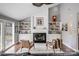 Bright living room showcasing a fireplace, built-in cabinets, and decorative items at 3619 Chilham Pl, Charlotte, NC 28226