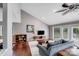 Comfortable living room with vaulted ceiling, hardwood floors, and access to outdoor space at 3619 Chilham Pl, Charlotte, NC 28226