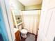 Cozy bathroom with bathtub shower combo, a ladder shelf, and gray rug in a neutral color scheme at 438 Starcrest Cir # C, Rock Hill, SC 29730
