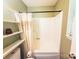 Cozy bathroom with bathtub shower combo, a ladder shelf, and white walls in a neutral color scheme at 438 Starcrest Cir # C, Rock Hill, SC 29730