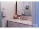 Bathroom vanity with a light pink marbled counter-top, a framed mirror, and modern hardware at 438 Starcrest Cir # C, Rock Hill, SC 29730