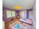 Bright bedroom with playful decor, two twin beds, and ample natural light at 438 Starcrest Cir # C, Rock Hill, SC 29730