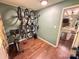 Spacious bonus room featuring bike rack, hardwood floors, and an entrance to the modern kitchen at 438 Starcrest Cir # C, Rock Hill, SC 29730