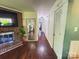 Long hallway featuring hardwood floors, a fireplace, and natural light from nearby rooms at 438 Starcrest Cir # C, Rock Hill, SC 29730