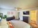 Bright main bedroom featuring ceiling fan, ensuite bathroom, closet, TV, and neutral decor at 438 Starcrest Cir # C, Rock Hill, SC 29730