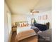 Inviting main bedroom featuring neutral decor, ceiling fan, bright window, dresser, and modern furnishings at 438 Starcrest Cir # C, Rock Hill, SC 29730