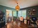 Bright home office featuring hardwood floors, a stylish desk, and shelving, promoting productivity at 438 Starcrest Cir # C, Rock Hill, SC 29730