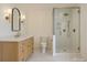 Clean, modern bathroom with glass shower, neutral tiling, and bright lighting at 4467 Woodlark Ln, Charlotte, NC 28211