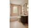 Cozy bathroom featuring a bathtub, shower, and stylish dark wood vanity at 4467 Woodlark Ln, Charlotte, NC 28211