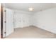 Spacious bedroom with plush carpeting, multiple closets, and ample natural light, perfect for comfort and storage at 4467 Woodlark Ln, Charlotte, NC 28211