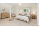 Comfortable bedroom with soft lighting, neutral decor, and a calming atmosphere at 4467 Woodlark Ln, Charlotte, NC 28211