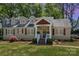 Charming single-Gathering home with manicured lawn, dormer windows and inviting front entrance at 4467 Woodlark Ln, Charlotte, NC 28211