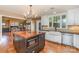 Bright kitchen featuring custom cabinets, hardwood floors and butcher block island at 4467 Woodlark Ln, Charlotte, NC 28211