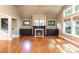 Bright living room boasts a fireplace, custom built-ins, and large windows that let in lots of natural light at 4467 Woodlark Ln, Charlotte, NC 28211
