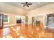 Open living area with hardwood floors, high ceilings, and seamless flow to the kitchen and dining spaces at 4467 Woodlark Ln, Charlotte, NC 28211