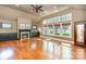Sun-filled living room with vaulted ceilings, a cozy fireplace, and large windows with views of the outdoors at 4467 Woodlark Ln, Charlotte, NC 28211