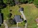 Aerial view of home, green lawn, driveway, and mature trees at 502 Hyde St, Kannapolis, NC 28083