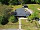 Aerial view of home with mature trees, driveway, and fenced yard at 502 Hyde St, Kannapolis, NC 28083