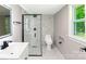 Modern bathroom showcasing marble tile, sleek vanity, and a glass-enclosed shower for a spa-like feel at 502 Hyde St, Kannapolis, NC 28083