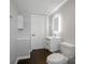 Bathroom featuring modern vanity, toilet, framed mirror, and updated fixtures at 502 Hyde St, Kannapolis, NC 28083