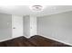 Bedroom view of hardwood floors, light gray walls, and a white closet door at 502 Hyde St, Kannapolis, NC 28083