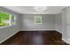 Bedroom showcasing hardwood floors, light gray walls, and windows with natural light at 502 Hyde St, Kannapolis, NC 28083