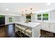 This eat-in kitchen is updated with an island, stainless appliances and modern fixtures at 502 Hyde St, Kannapolis, NC 28083