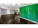 Spacious living area with wood flooring and custom green accent wall at 502 Hyde St, Kannapolis, NC 28083