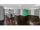 Open-concept living area featuring modern floors, and a stylish, updated kitchen with stone countertops at 502 Hyde St, Kannapolis, NC 28083