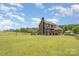 Expansive backyard featuring lush greenery and ample space for outdoor activities at 5047 Victory Trl, Gastonia, NC 28056