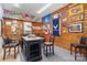 Cozy game room with wood paneled walls and a sitting area, ideal for relaxation and recreation at 5047 Victory Trl, Gastonia, NC 28056