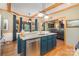 Spacious kitchen island with stainless steel dishwasher and granite countertops with wooden ceiling beams at 5047 Victory Trl, Gastonia, NC 28056