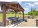 Inviting covered patio with comfortable seating, a firepit, and expansive backyard views at 5047 Victory Trl, Gastonia, NC 28056
