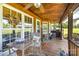 Inviting outdoor space featuring a cozy seating area with wooden deck and ceiling fan at 5047 Victory Trl, Gastonia, NC 28056