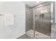 Modern bathroom featuring a glass-enclosed shower with gray tile surround and built-in niche at 510 Black Bear St # 145P, China Grove, NC 28023