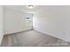 Empty bedroom with neutral carpeting, light gray walls, and a window at 510 Black Bear St # 145P, China Grove, NC 28023
