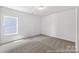 Bright, empty bedroom with a window. Neutral color scheme, ready for your personal touch at 510 Black Bear St # 145P, China Grove, NC 28023