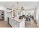 Open-concept kitchen flowing into the dining and living areas, perfect for entertaining at 510 Black Bear St # 145P, China Grove, NC 28023